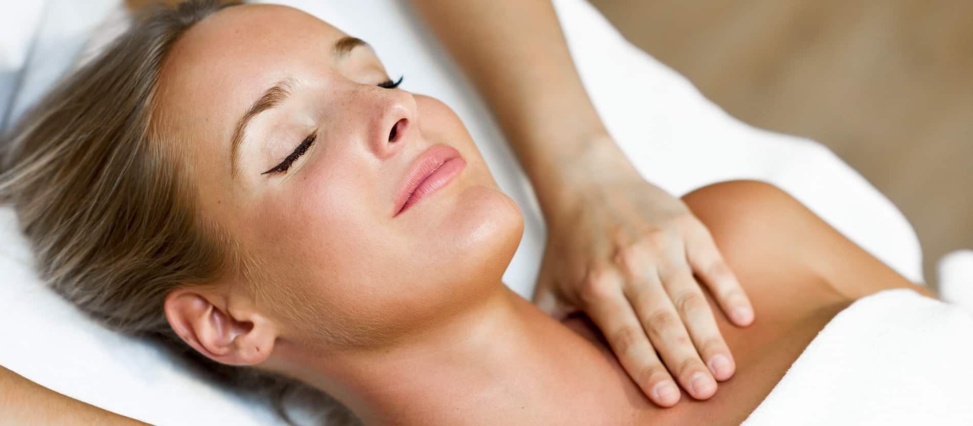 A client relaxing during an expert massage at Birmingham Wellness Massage
